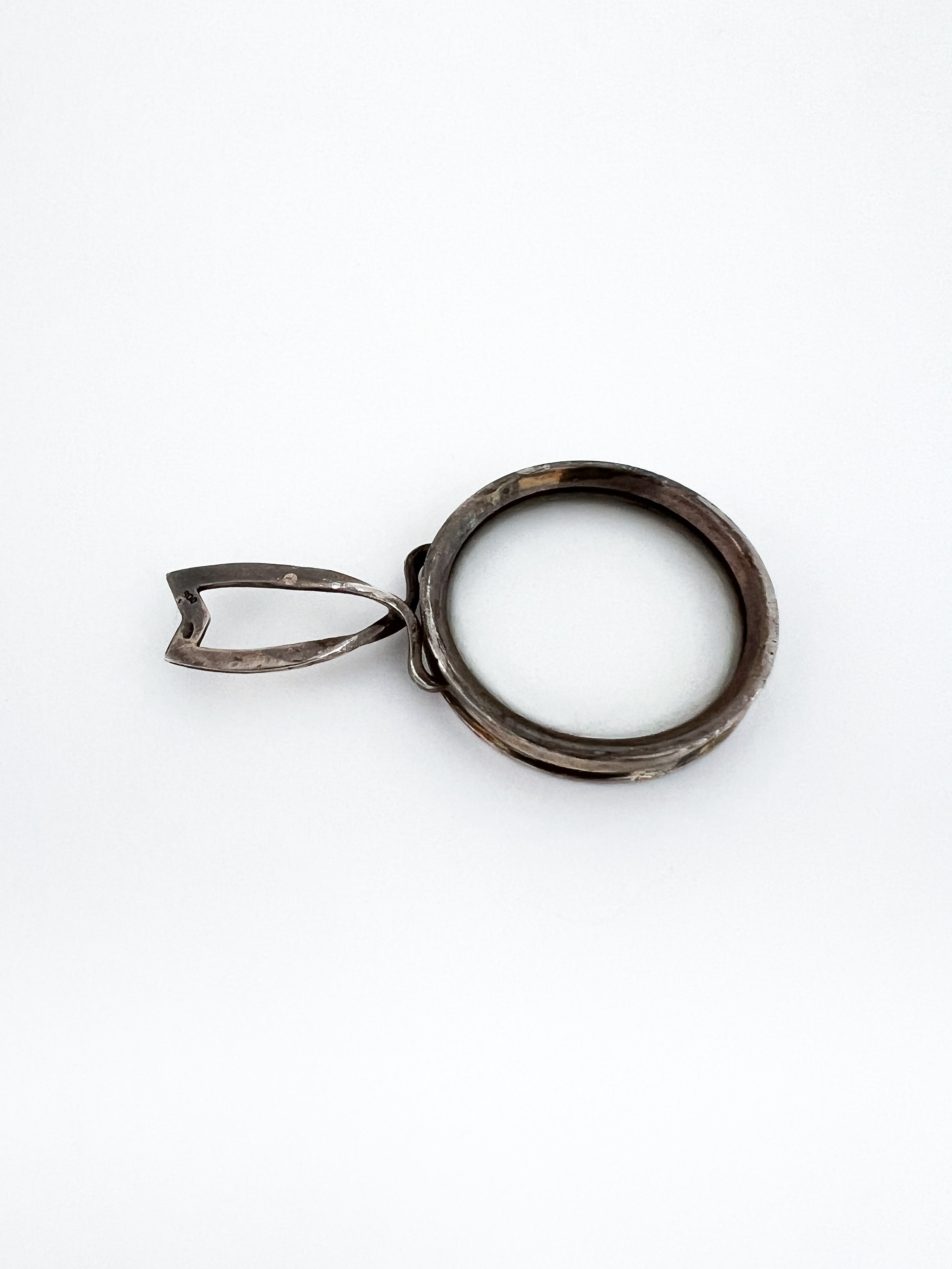 Silver magnifiying glass